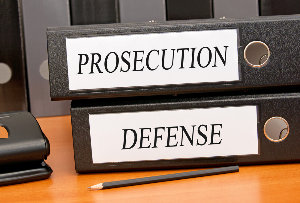 Binders reading prosecution and defense