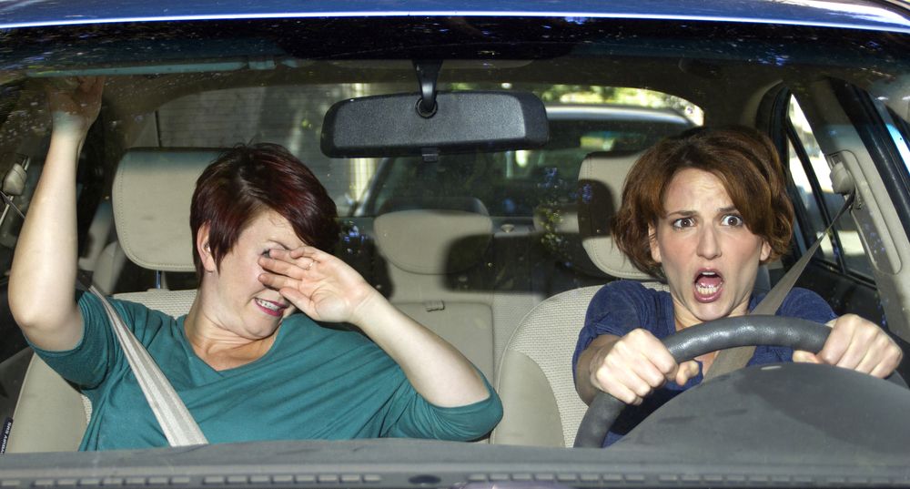female driver and passenger avoiding car crash