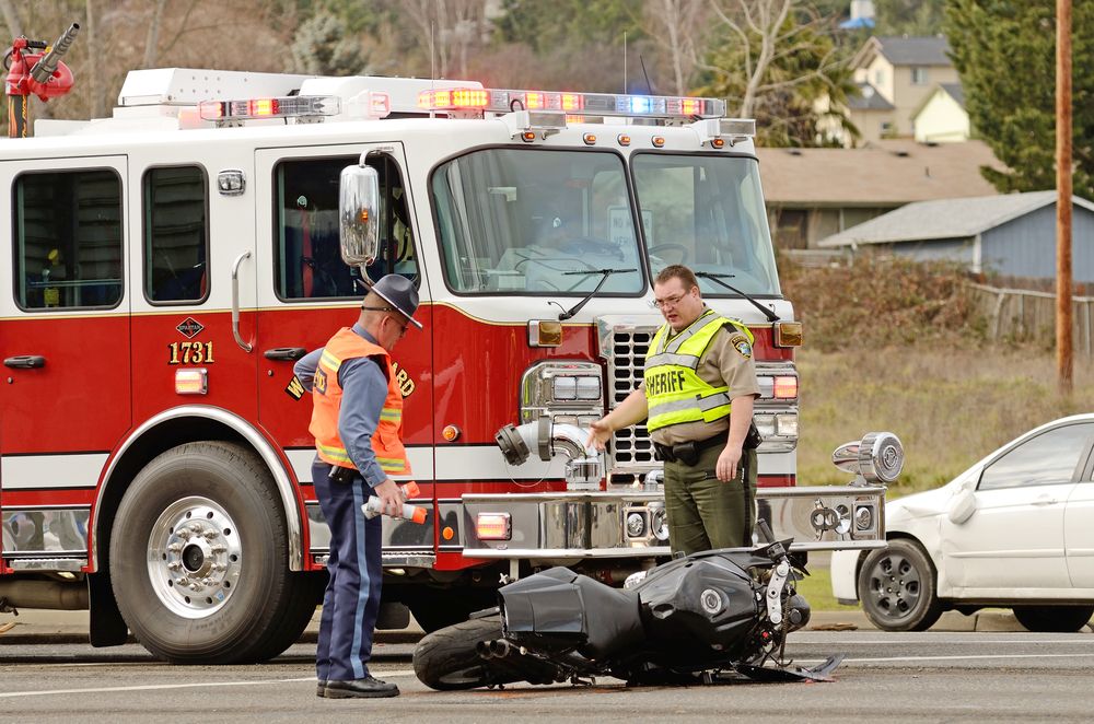 motorcycle crash with fire truck on scene