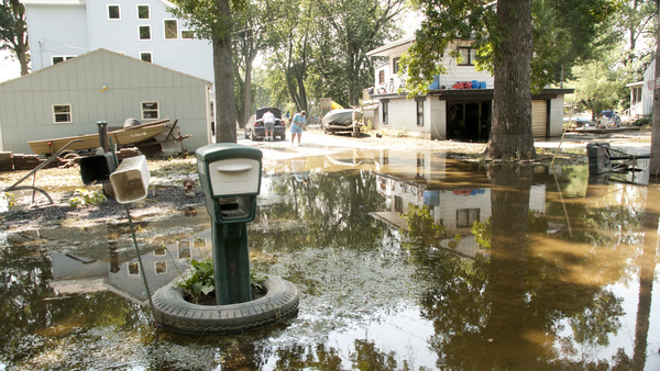 Following torrential rain showers that caused flooding in Roscoe, Ill., in August 2010, residents began the long clean-up process. Photo: Patsy Lynch/FEMA