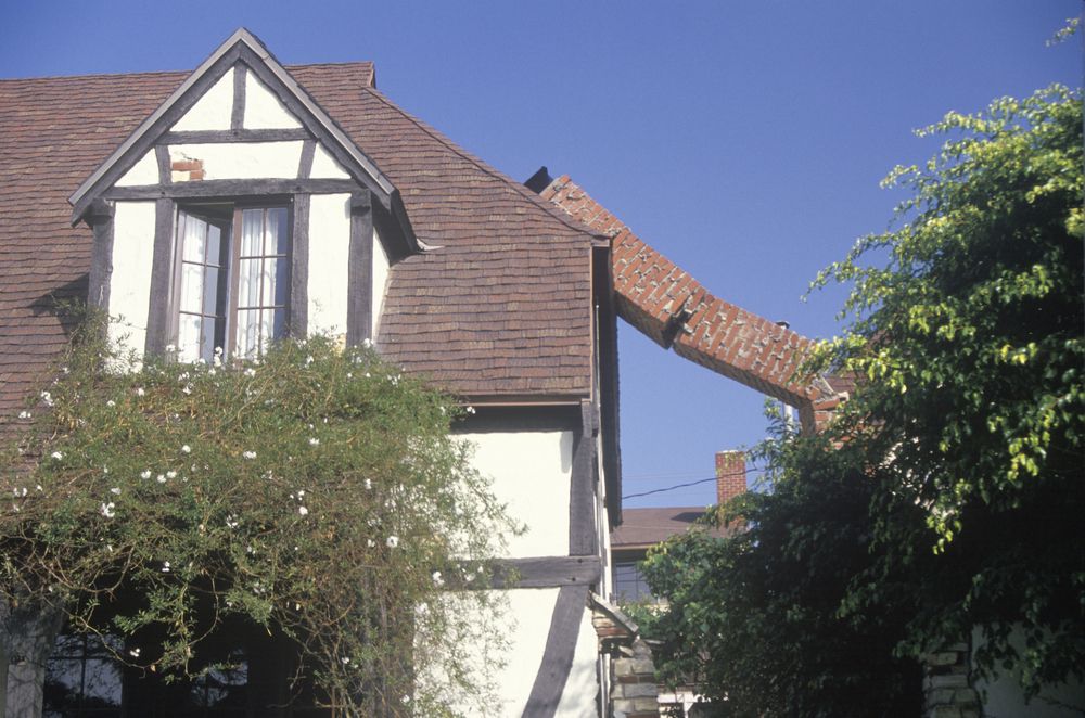 home chimney damaged by earthquake