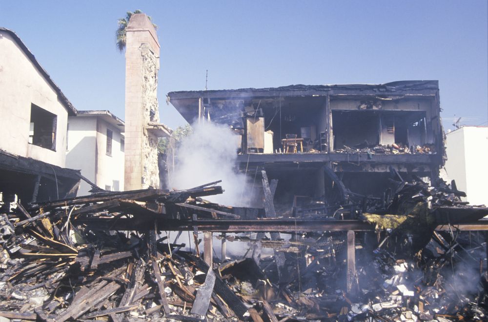 apartment building on fire as a result of the Northridge earthquake in 1994