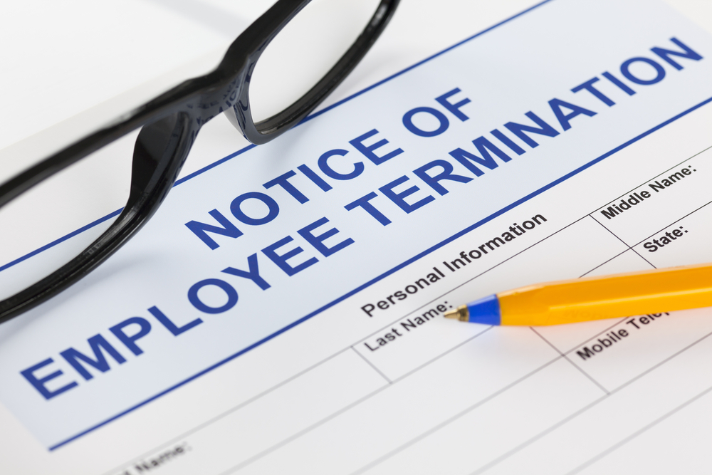 Notice-of-employee-termination-with-glasses-and-ballpoint-pen-SS-Ekaterina_Minaeva
