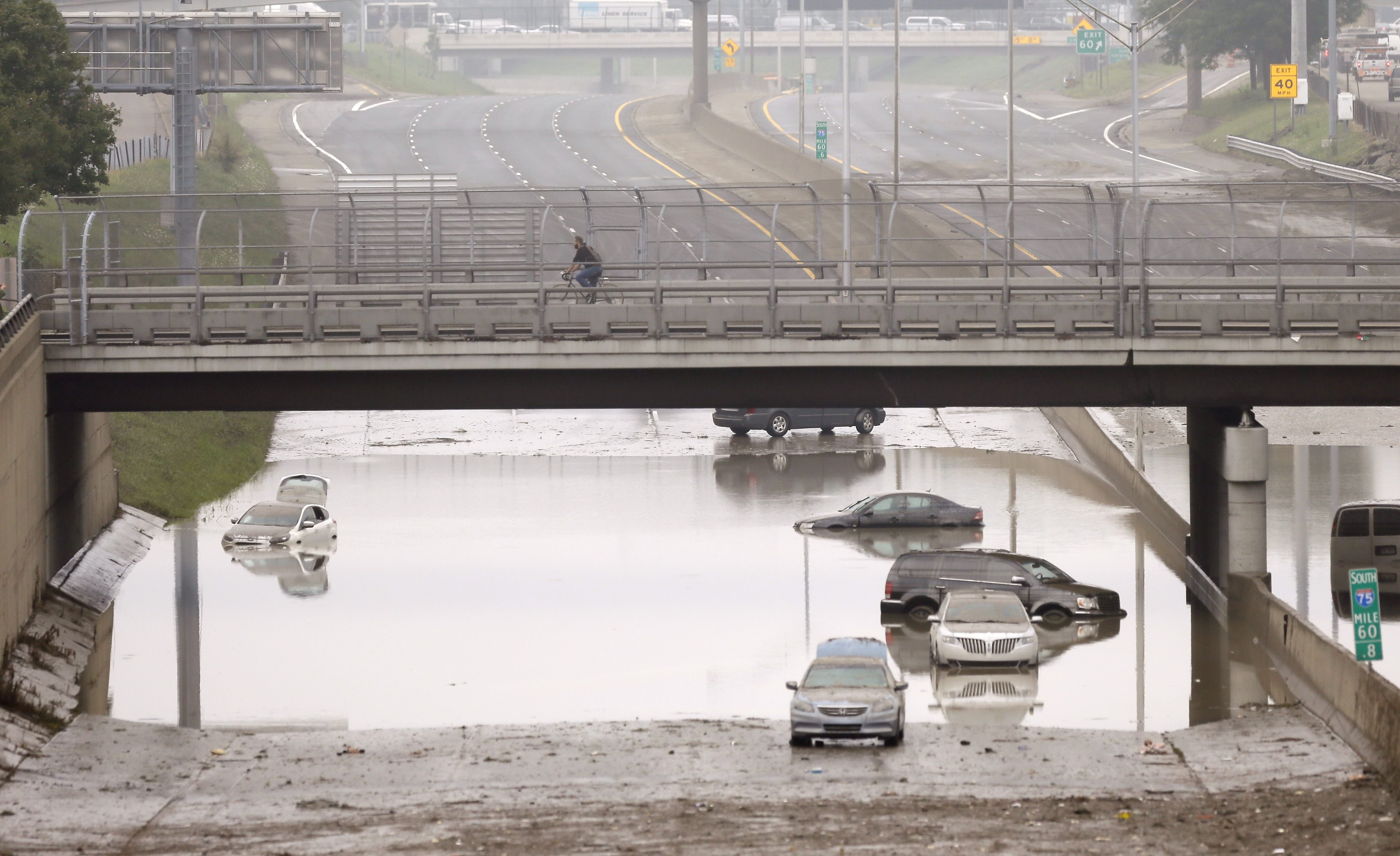 Cars are stranded along a flooded stretch of Interstate 75 in Hazel Park, Mich.