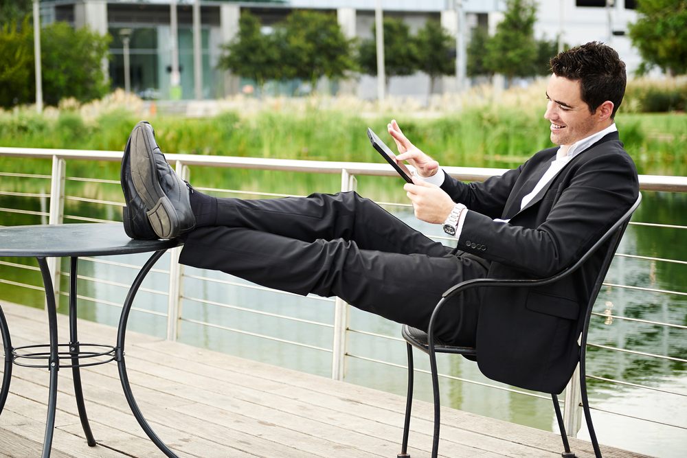 millennial businessman using a tablet