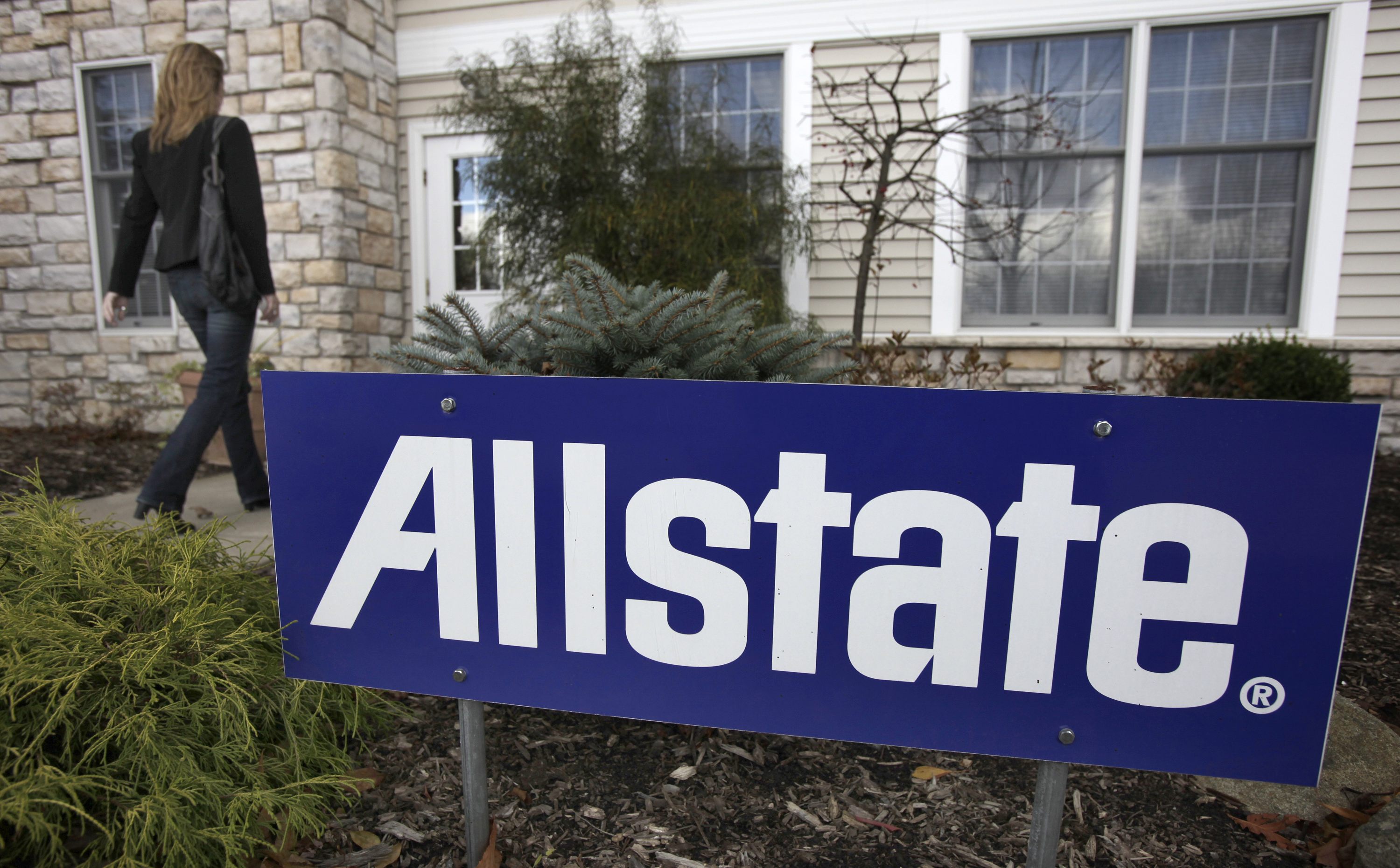 A woman walks into an Allstate insurance office in South Russell, Ohio