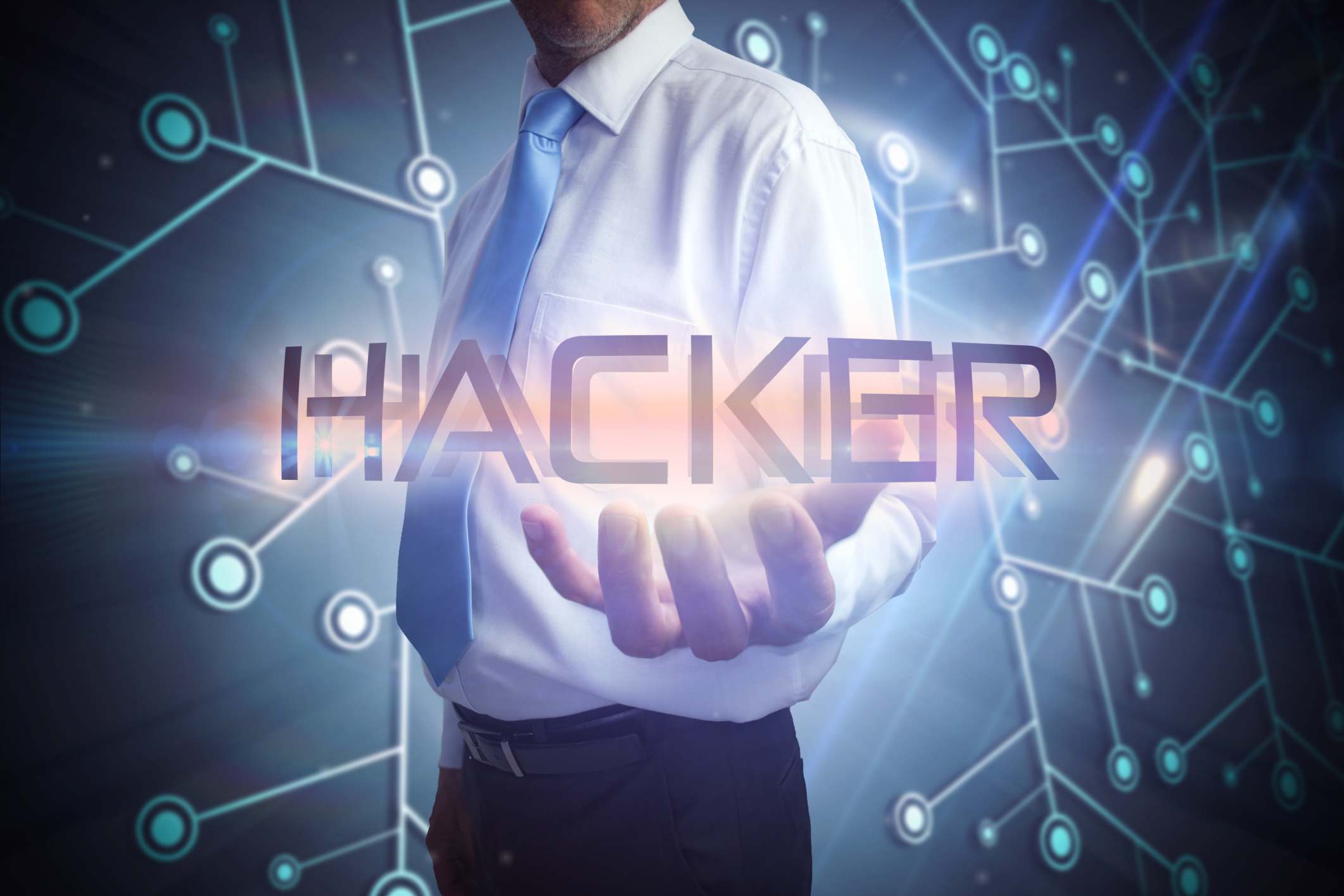 businessman holding the word Hacker