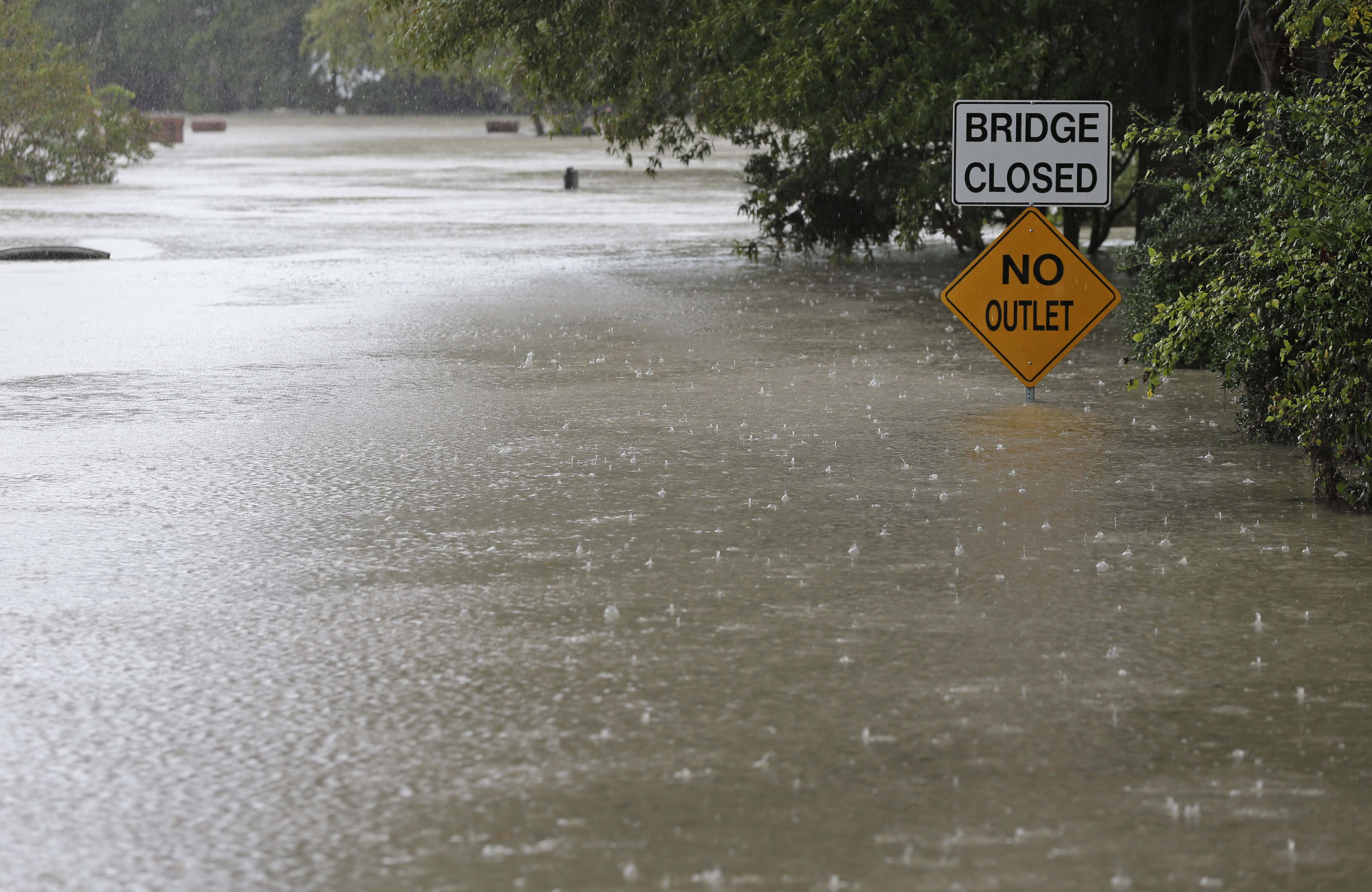 Floodwaters cover a road in Columbia, S.C., Sunday, Oct. 4, 2015. 
