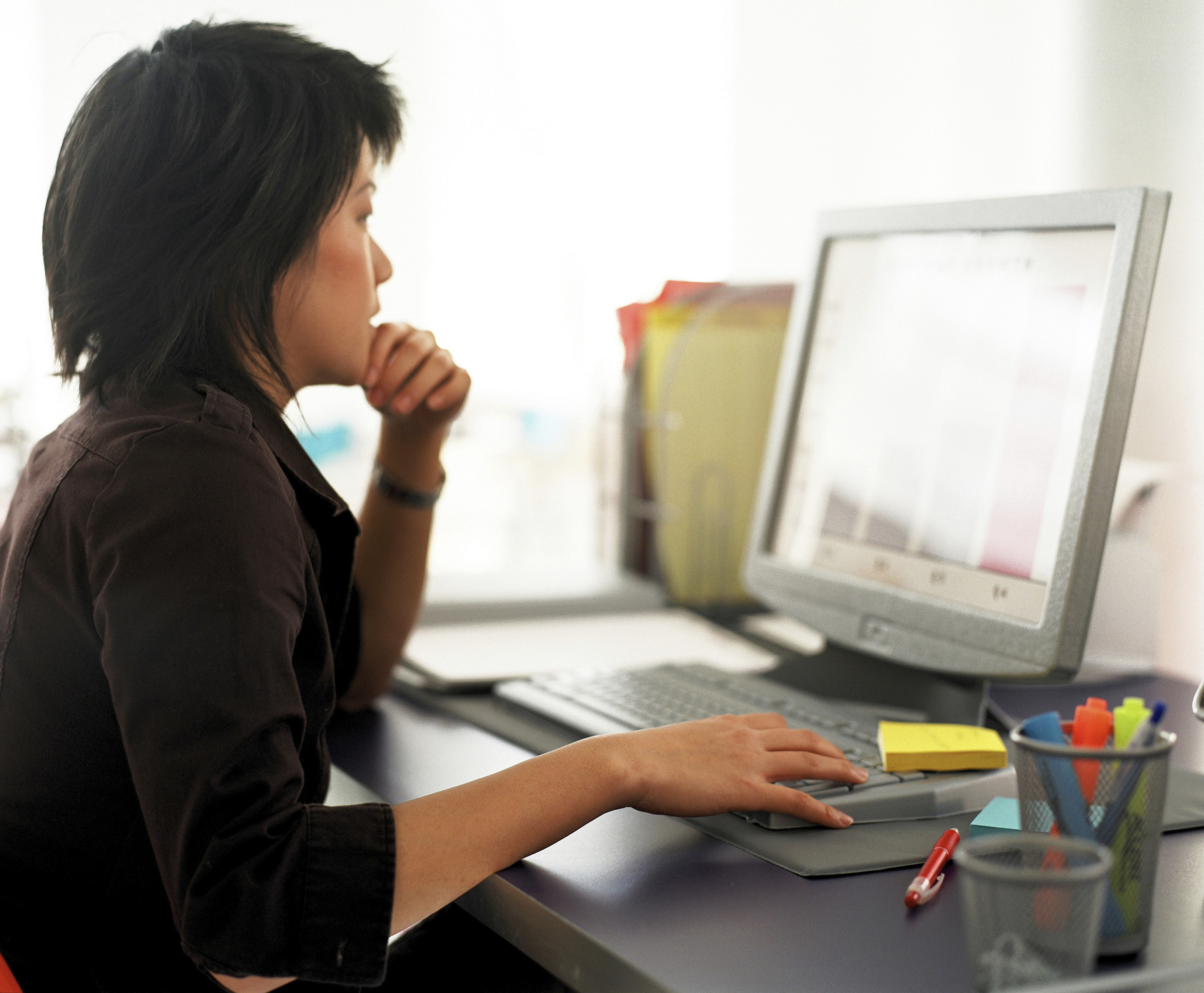 Asian-woman-working-on-laptop-in-office-ThinkstockPhotos-87455862-Ablestock.com