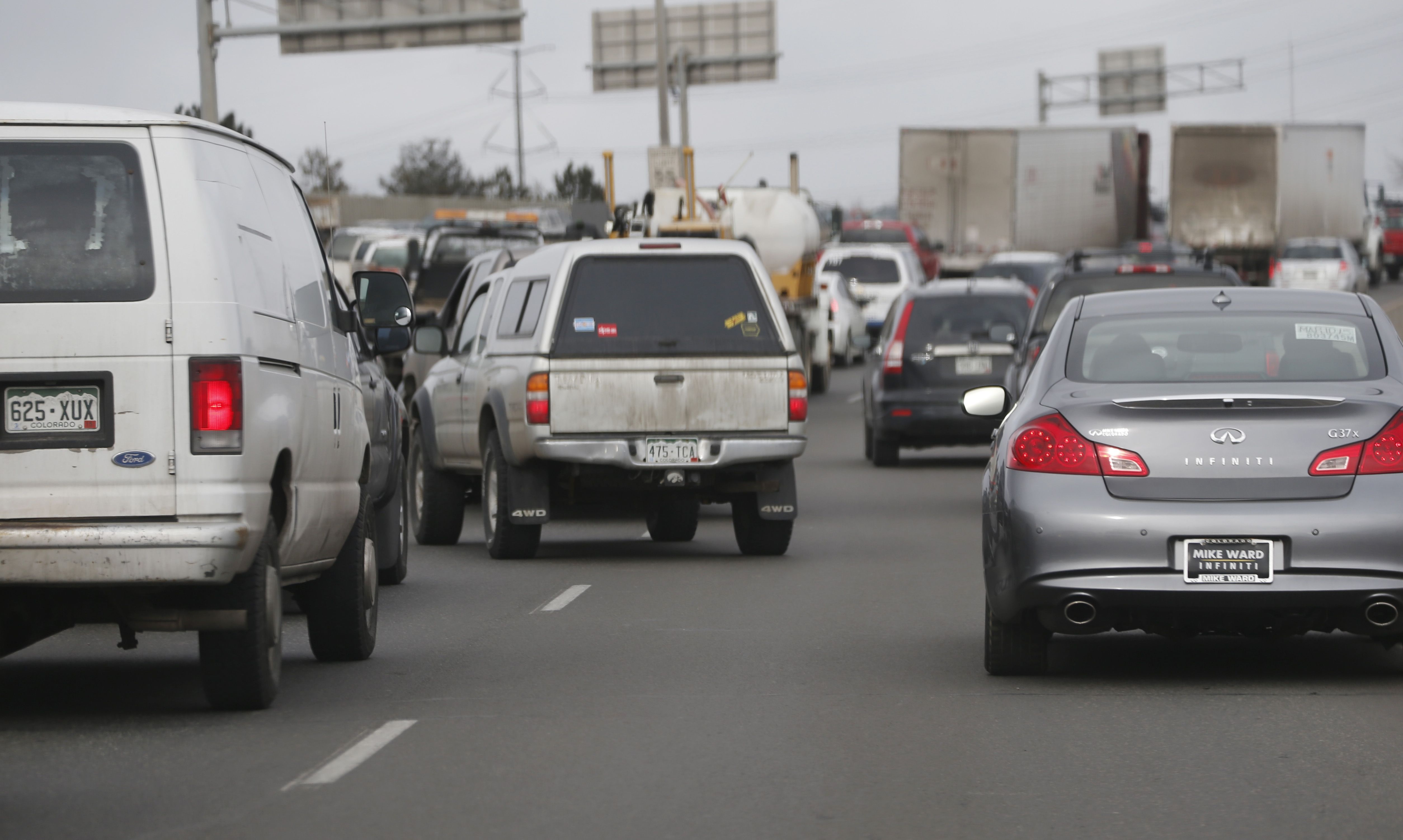 Traffic comes to a halt as motorists struggle to enter lanes Friday, Feb. 20, 2015, on Interstate 25 northbound out of downtown Denver. 
