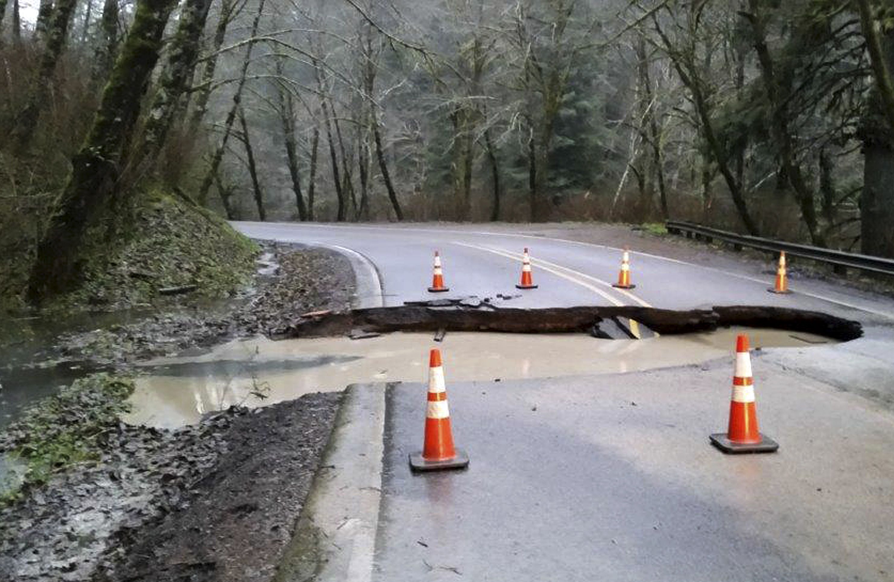 Sinkhole on Highway 22 in Yamhill County, Ore., Tuesday, Dec. 8, 2015.