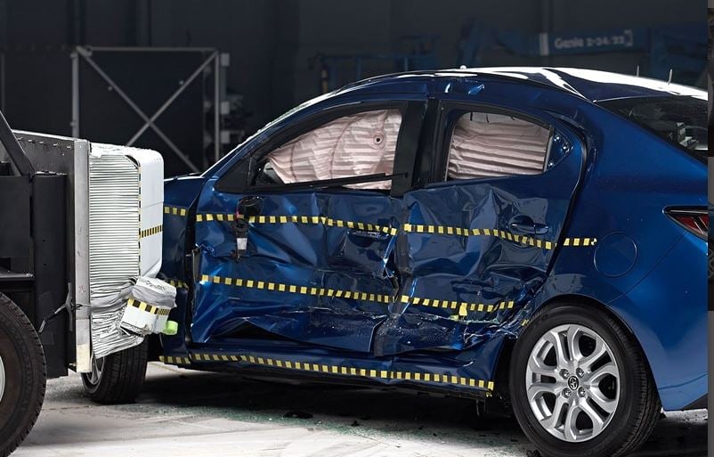 View of the Scion iA and barrier just after the side impact crash test