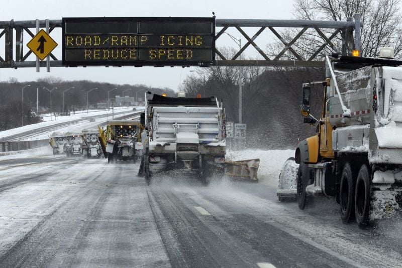 Snow plows clear the Long Island Expressway, Tuesday, Jan. 27, 2015 in Central Islip, N.Y.