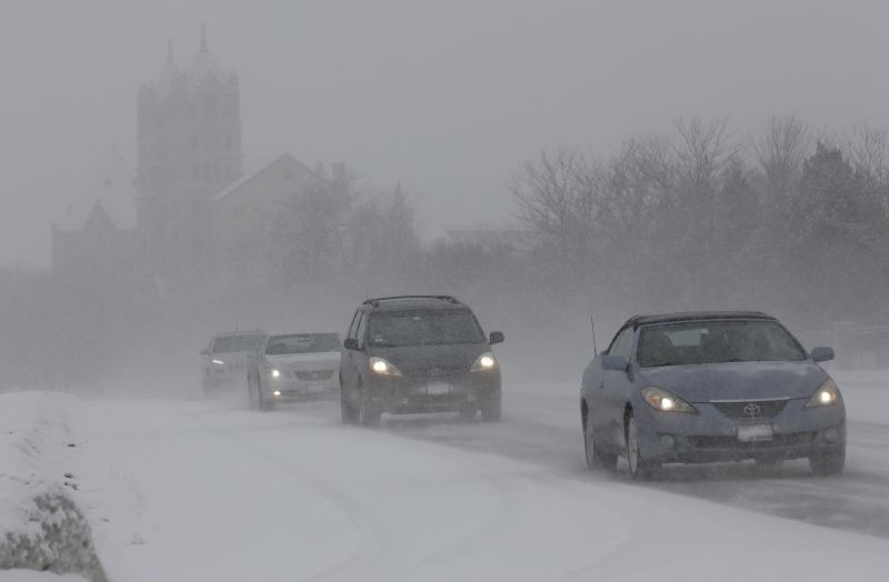 Traffic slowly moves down Waukegan Road on Sunday, Feb. 15, 2015, in Northbrook, Ill. 