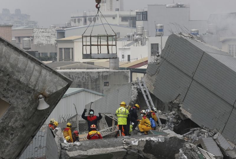 Rescue teams continue to search for the missing in a collapsed building