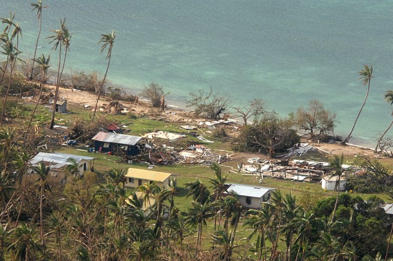 debris is scattered around damaged buildings at Susui village in Fiji, after Cyclone Winston tore through the island nation. 