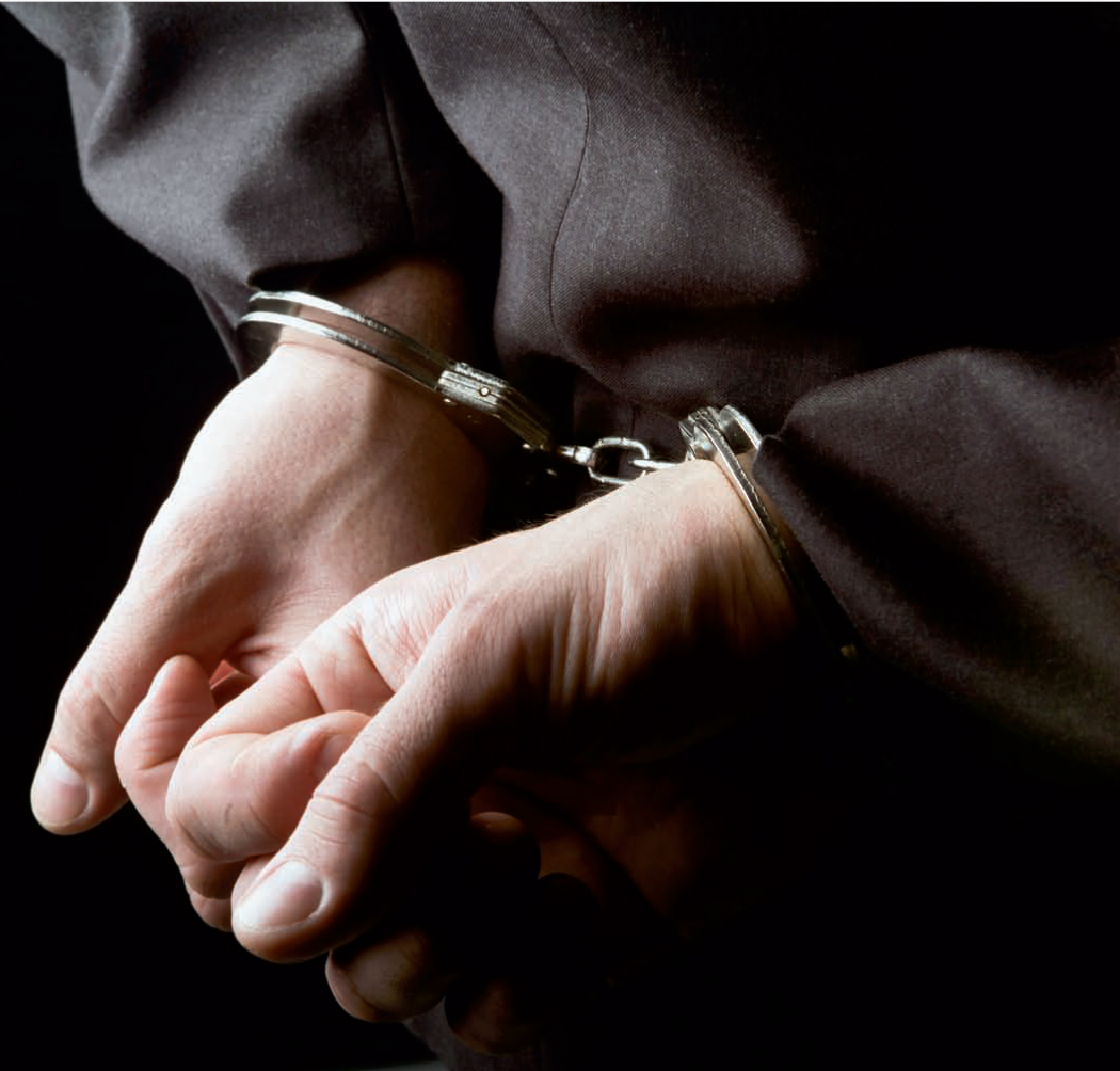 Person-in-handcuffs-Shutterstock