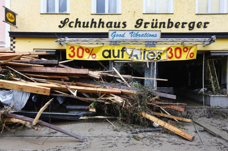 Wooden blocks lie on front of a store damaged by floods in Simbach am Inn, Germany