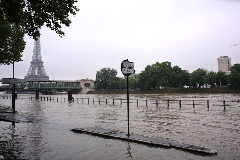 Overflowing embankments are seen near the Eiffel Tower, in Paris, Wednesday, June 1, 2016.