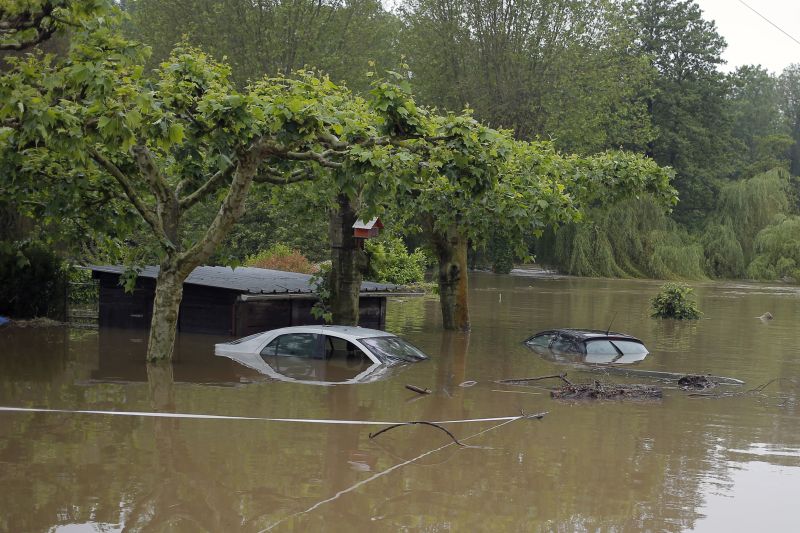 Cars emerge in a flooded parking in Souppes Sur Loing, 60 miles south of Paris