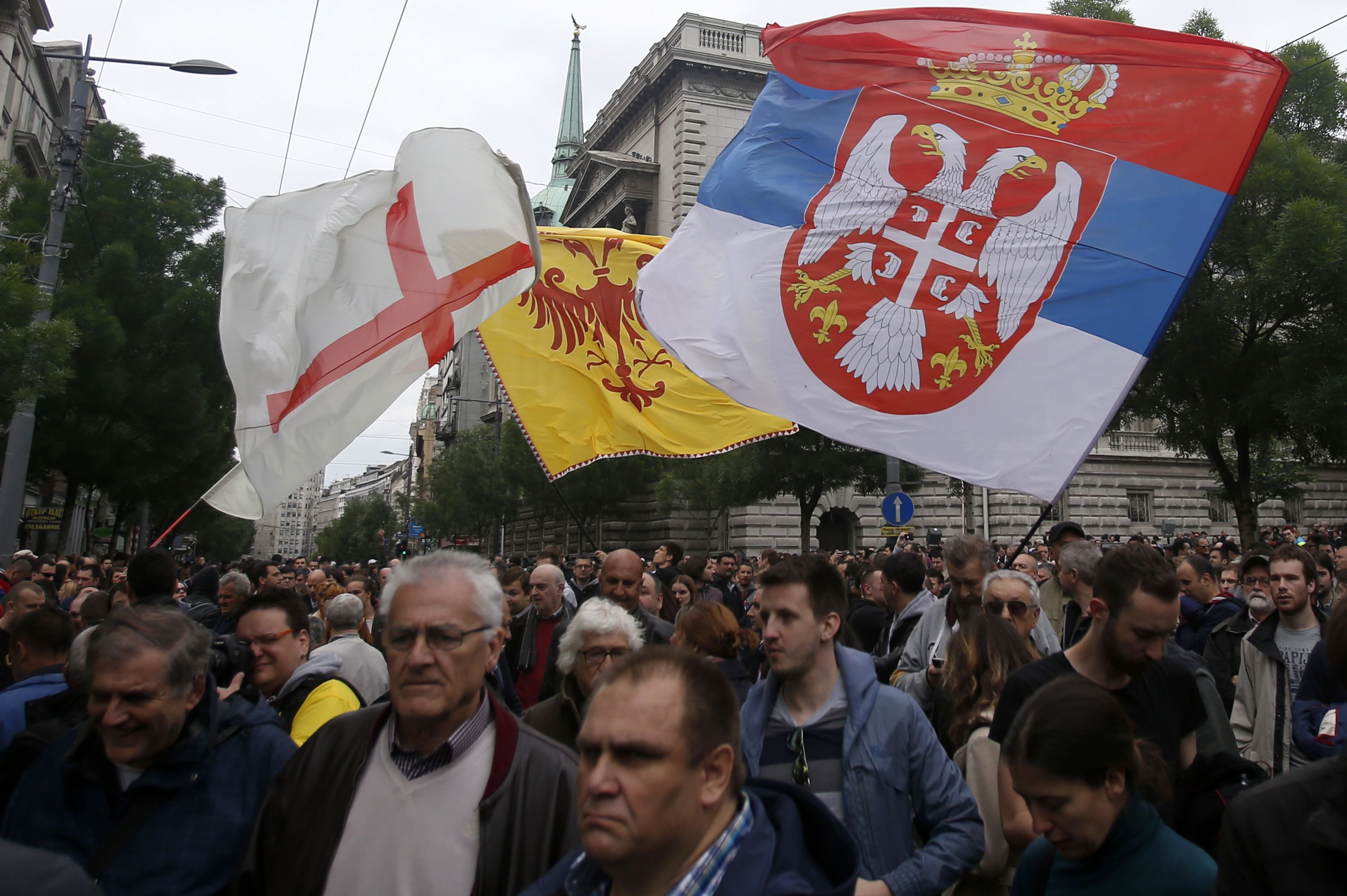 Opposition supporters wave flags during an opposition protest in Belgrade, Serbia