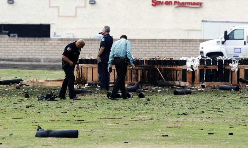 Police officials investigate a site in Simi Valley, Calif., Friday July 5, 2013 where an explosion injured more than two dozen people
