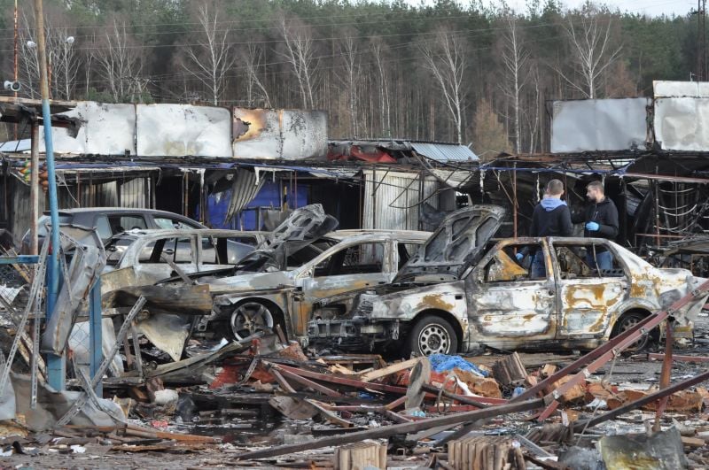 Burnt debris and damaged cars following an explosion at a fireworks stand 