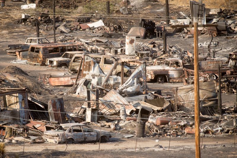 Scorched cars and trailers burned by the Blue Cut fire 
