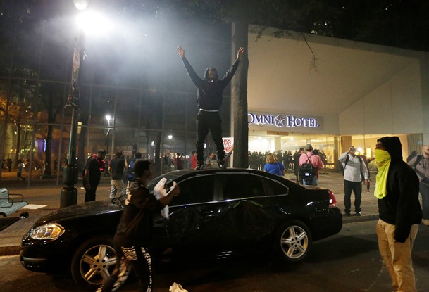 Protester on top of car Charlotte NC 092212016