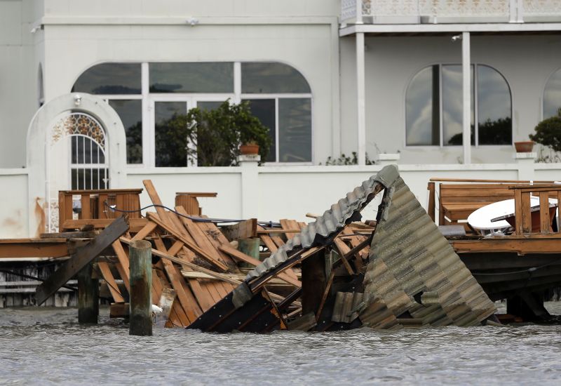 A dock on a water-front home is shown after being damaged by Hurricane Matthew