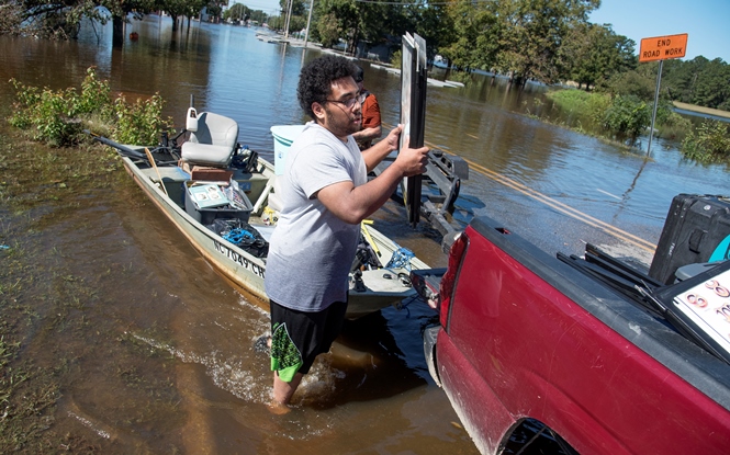 man with boat Hurricane Matthew