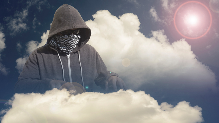 Hacker in hoodie with face mask in cloud