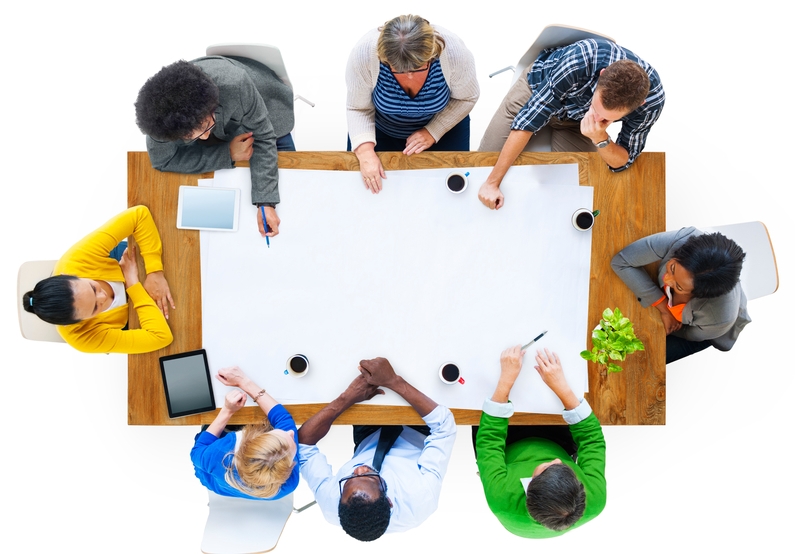 Diverse team meeting around conference table