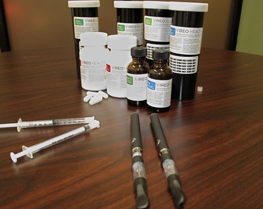 Medical marijuana bottles and syringes