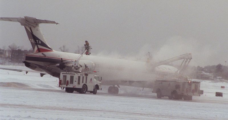 A Delta MD-80 aircraft is de-iced before cleared for flight at Laguardia Airport in New York, Saturday February 3, 1996