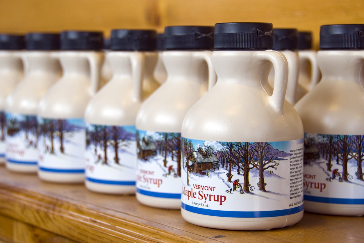 Rows of bottles of Vermont maple syrup