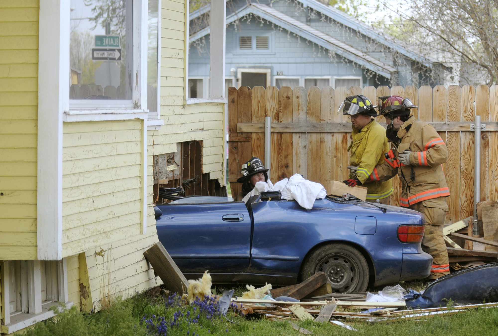 Car crashes into house in Idaho with firefighters