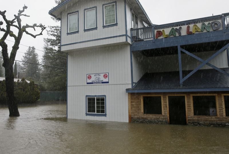 Flooding surrounds an arcade and miniature golf course