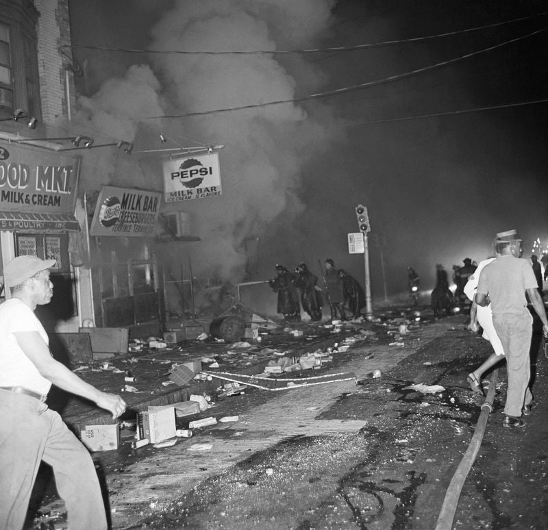 Newark firemen try to save burning structures early July 14, 1967 in Newark. N.J. after rioting erupted