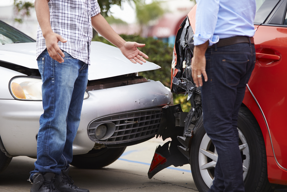 two men discussing an auto accident