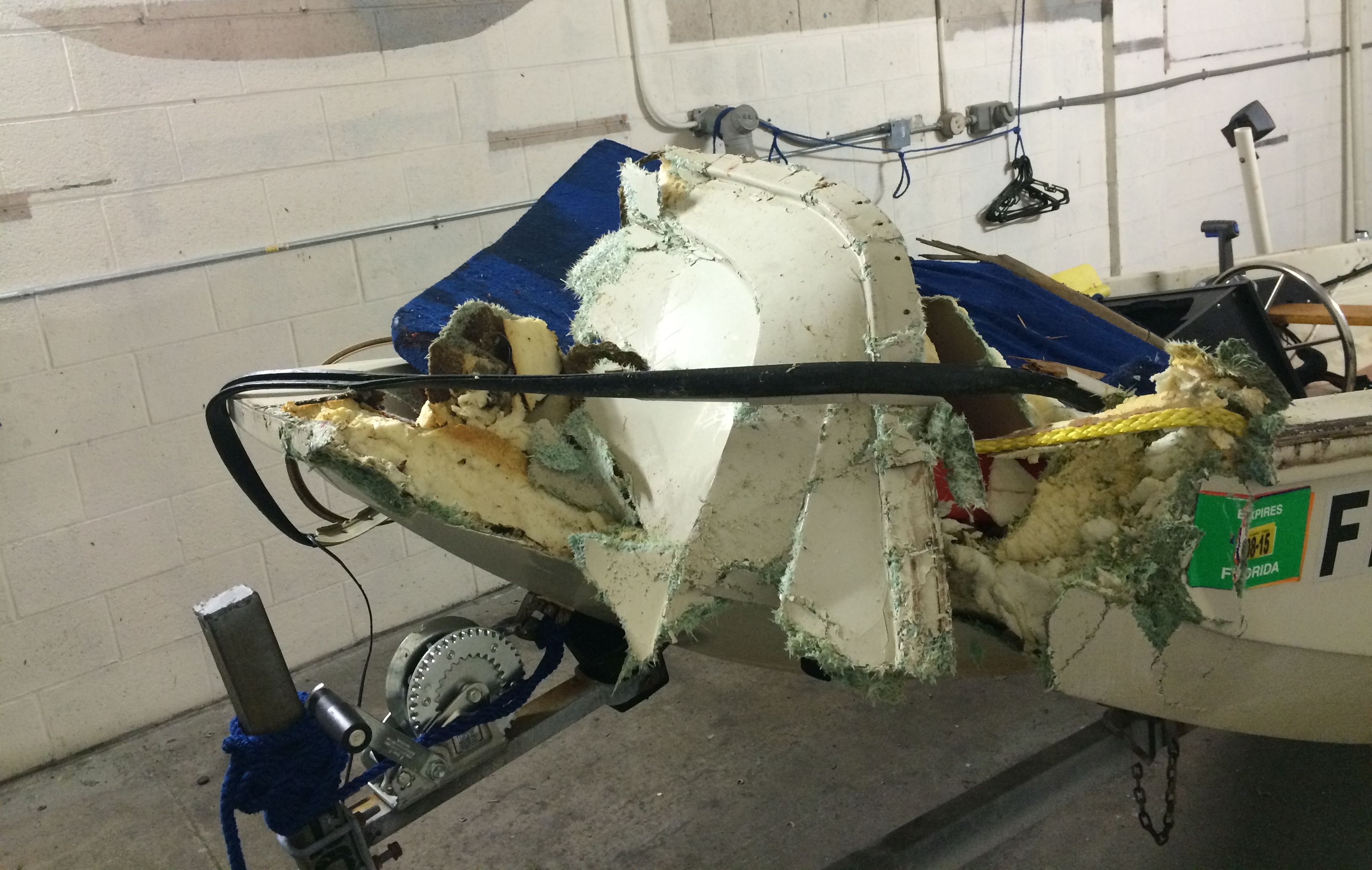 damaged front of a 13-foot boat that six teenagers were riding before they collided with a bridge 