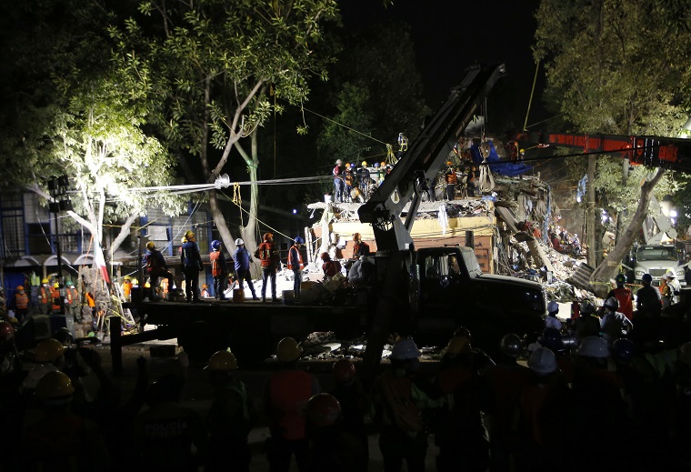 Personnel work in rescue operations in the rubble of a building felled by a 7.1 magnitude earthquake, in the Ciudad Jardin neighborhood of Mexico City, Thursday, Sept. 21, 2017. Thousands of professionals and volunteers are working frantically at dozens of wrecked buildings across the capital and nearby states looking for survivors of the powerful quake that hit Tuesday. (AP Photo/Eduardo Verdugo)