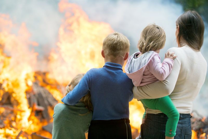 Mother and children watching home fire