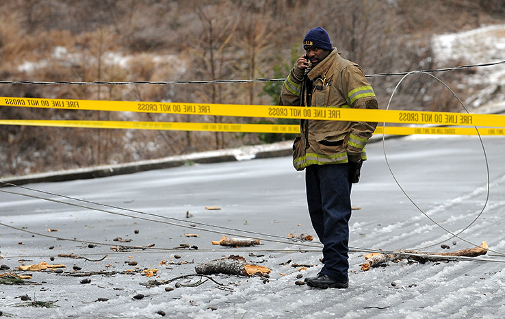 Downed power lines Atlanta police officer on cell phone